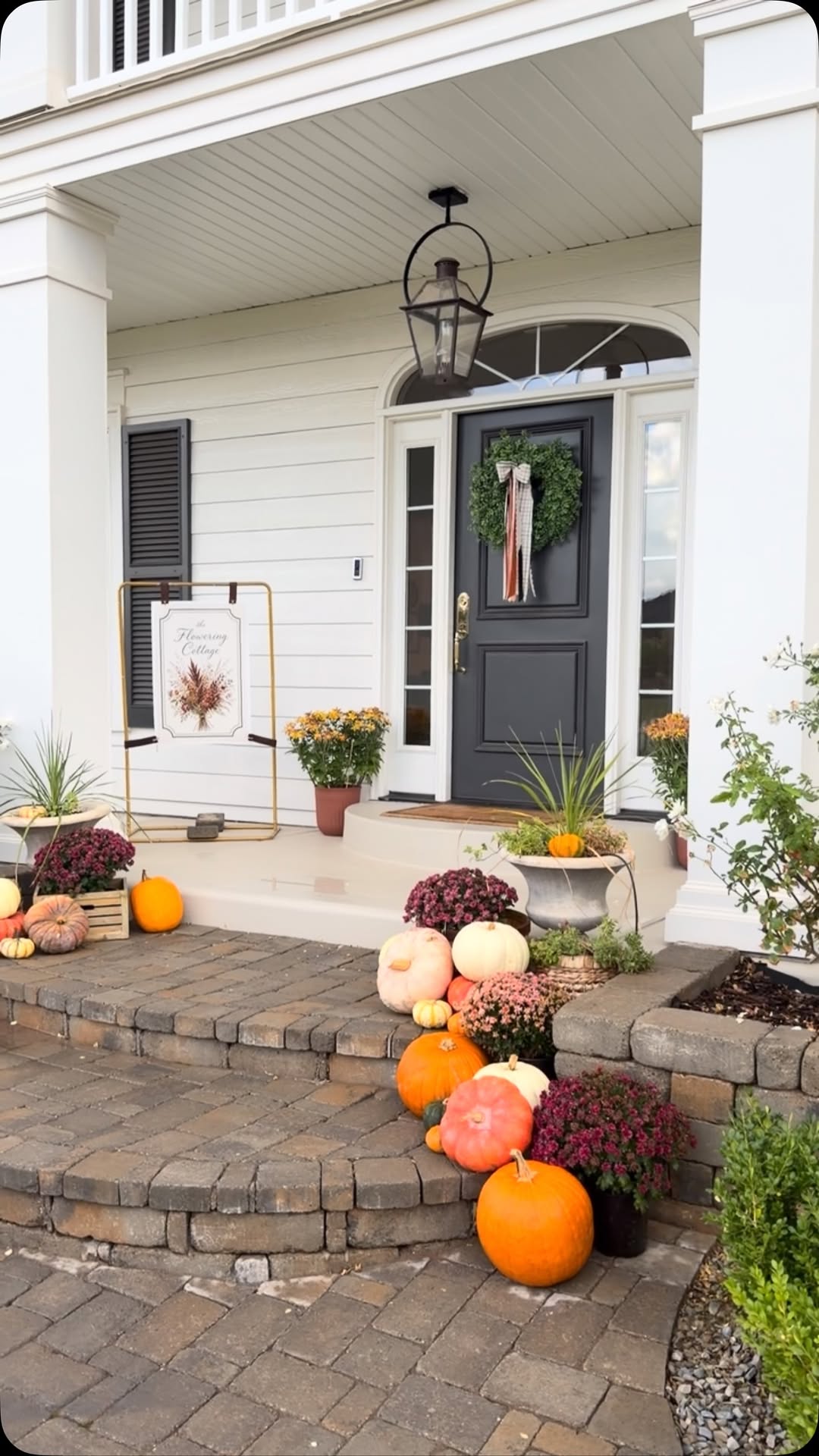 The Flowering Cottage farmhouse porch decorated for fall